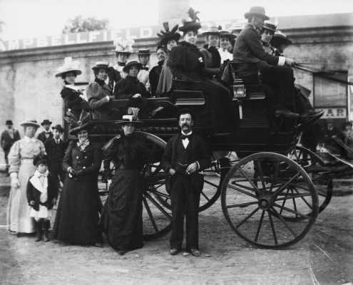 Group of  people gathered around and upon a carriage outside the Campbellfield Hotel.
