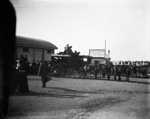 A scene on a wharf and pier, probably on the shores of Port Phillip Bay, Victoria.