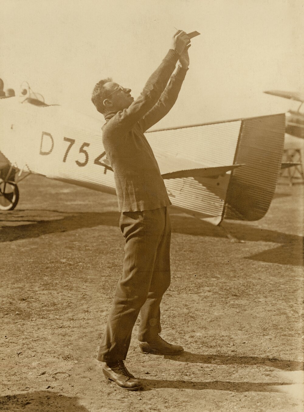 Fritz Loewe standing in front of a Junkers A20
