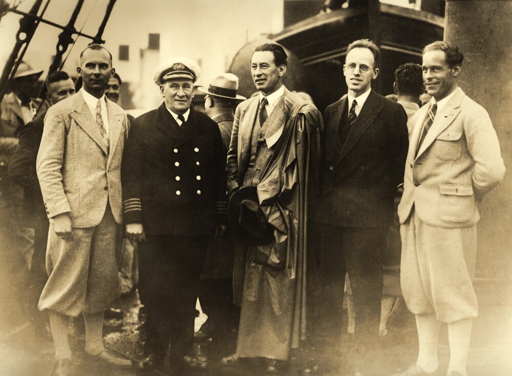 Group of men standing on deck