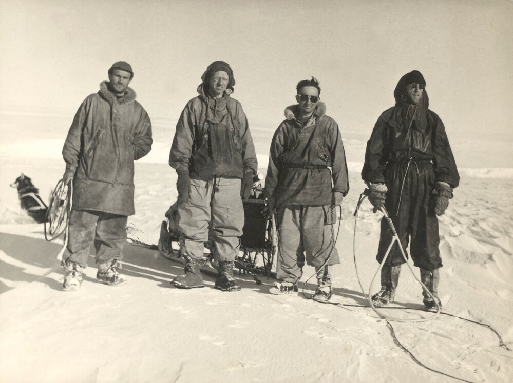 Four men dressed in expedition gear