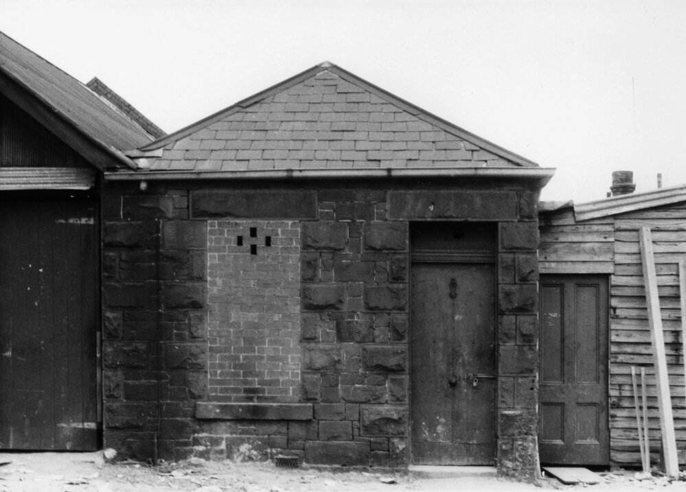 A small dwelling behind buildings in Faraday  Street, Carlton, Victoria.