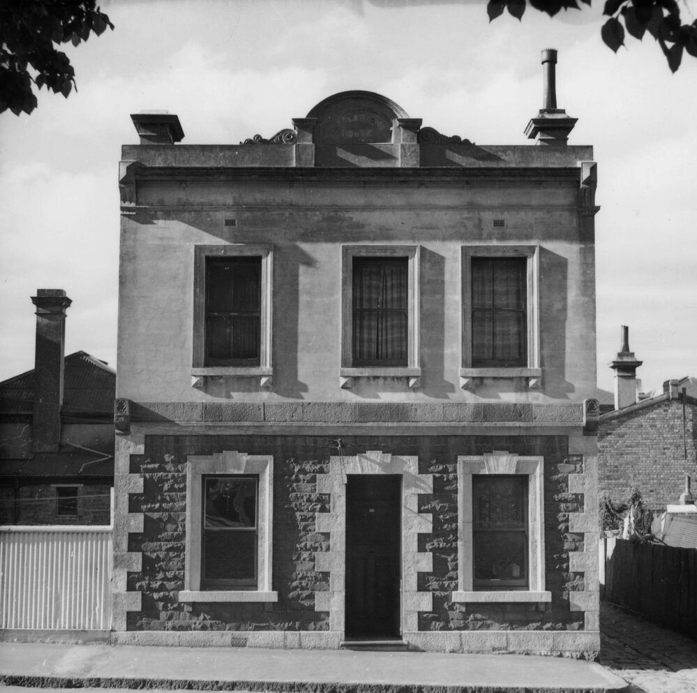 A two storey dwelling in Macarthur Place, Carlton, Victoria.