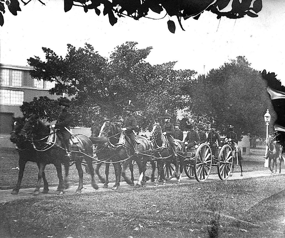Soldiers with horses and wagon.