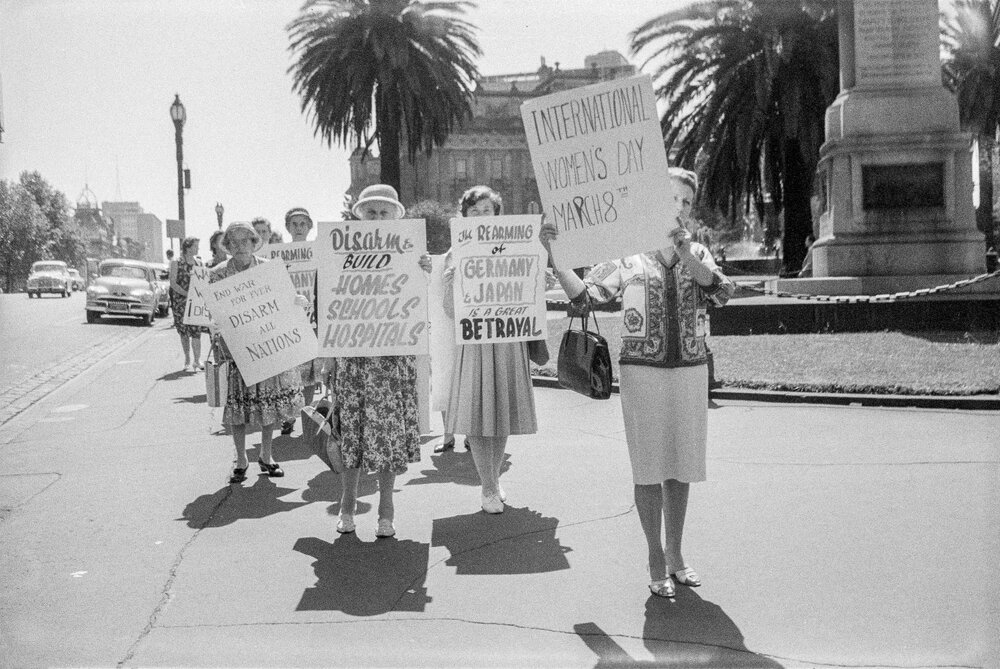 Women march along Spring Street, Melbourne for International Women's Day, 1962.