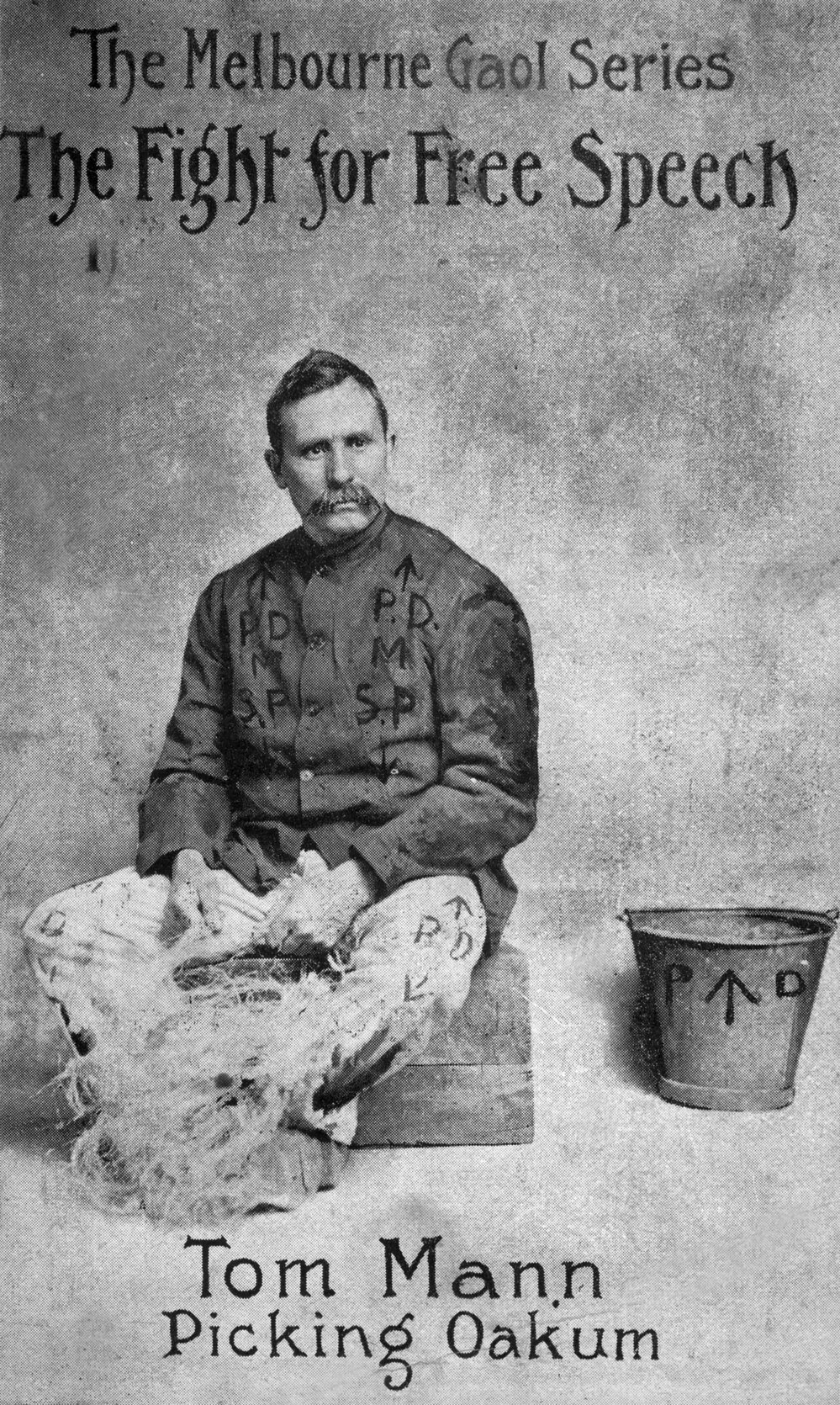 Tom Mann in a prison uniform picking oakum.
