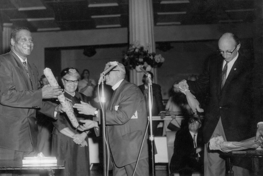 Paul Robeson and his wife being welcomed at a reception in Melbourne in 1960.