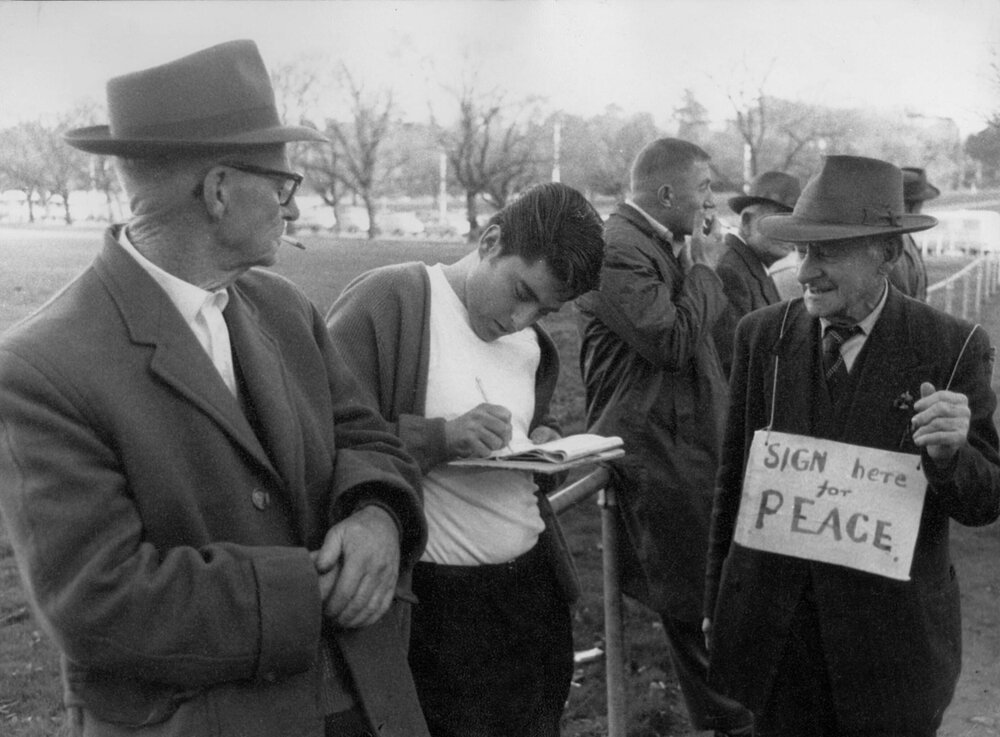 Gathering signatures for a peace petition in Melbourne.