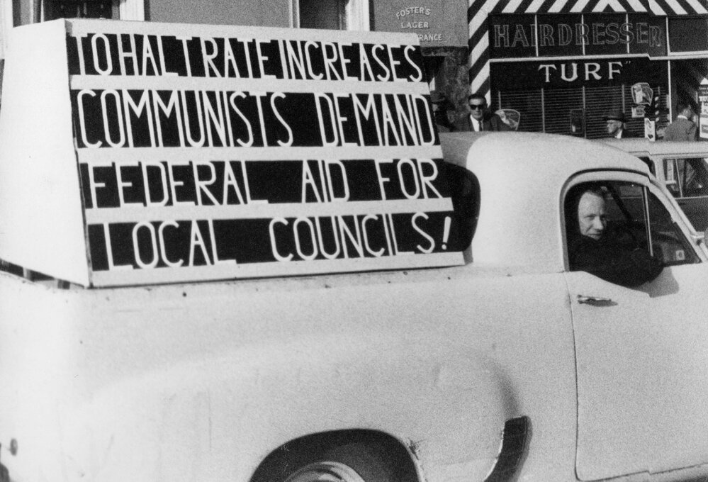 A utility carrying a sign protesting in support of Commonwealth Government aid for municipal councils.