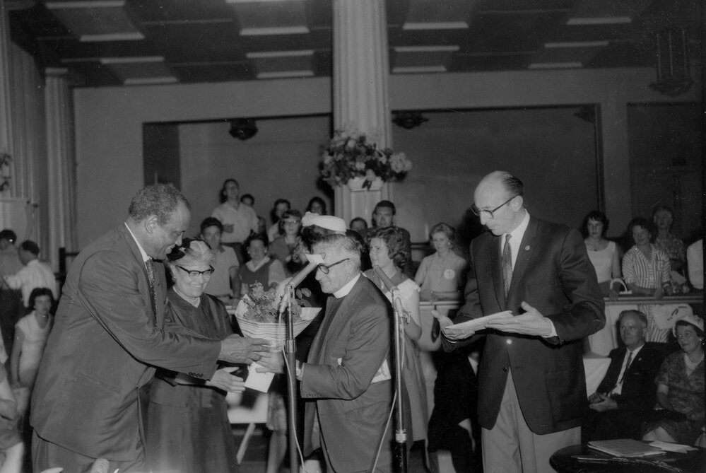 Paul Robeson and his wife being welcomed at a reception in Melbourne in 1960.