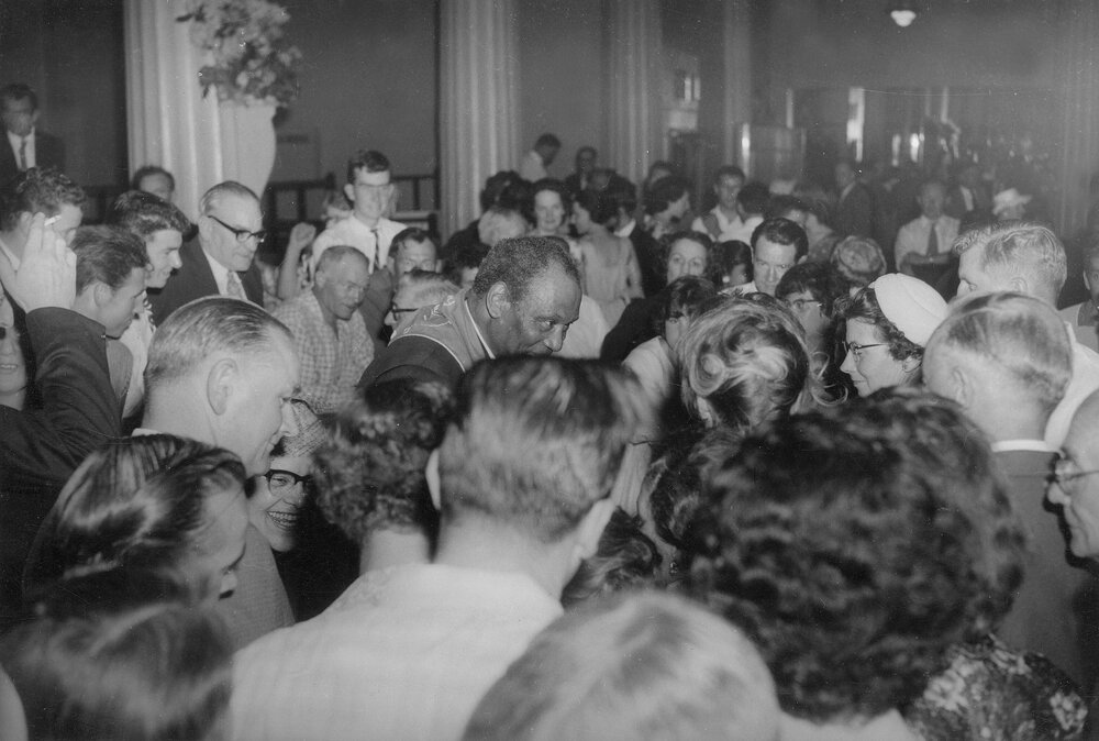 Paul Robeson being welcomed by friends and admirers at a reception in Melbourne in 1960.