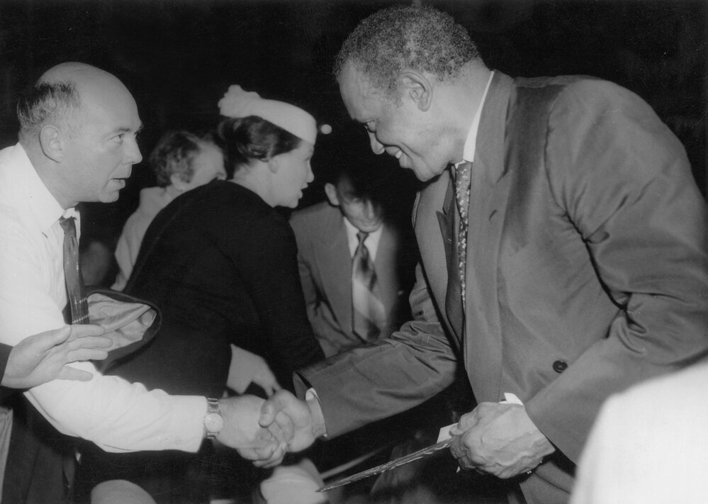 Paul Robeson being welcomed by Jim Munro at a reception in Melbourne in 1960.