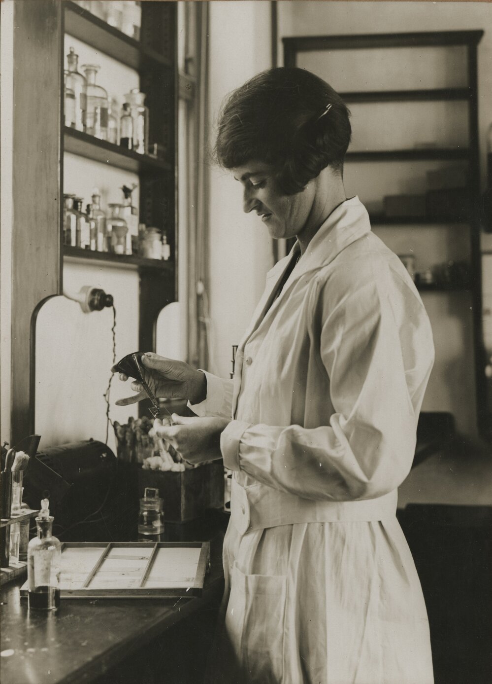 Dr. Lucy Bryce in a laboratory, University of Melbourne, 1925-1940.