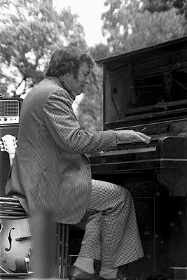 Graeme Bell playing the piano at a jazz concert.