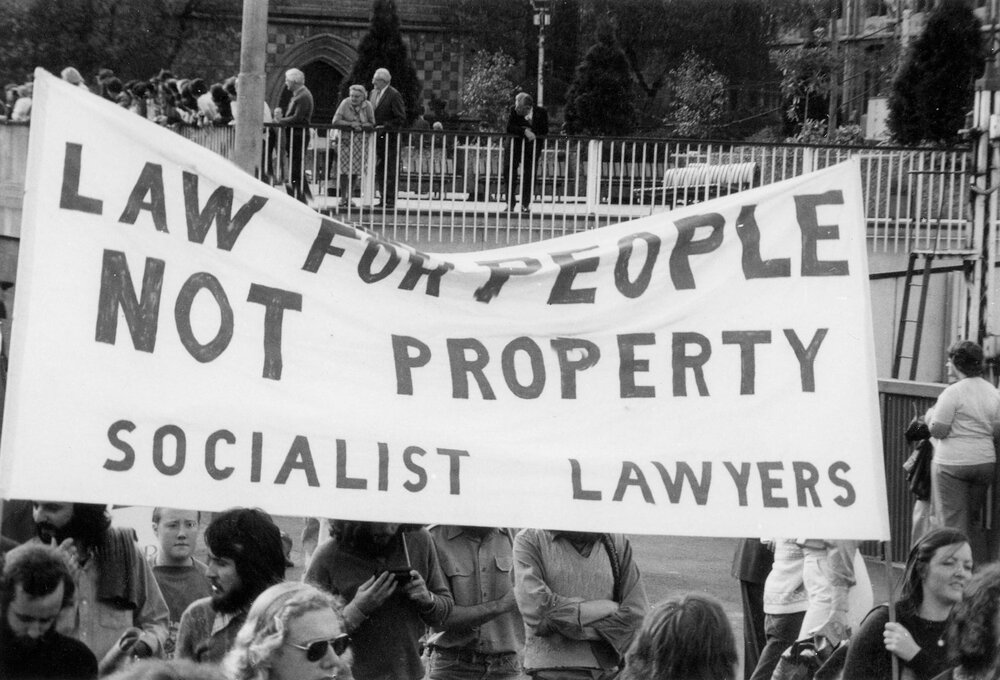 May Day march, 1975 in Melbourne with banner "Law for people not property"