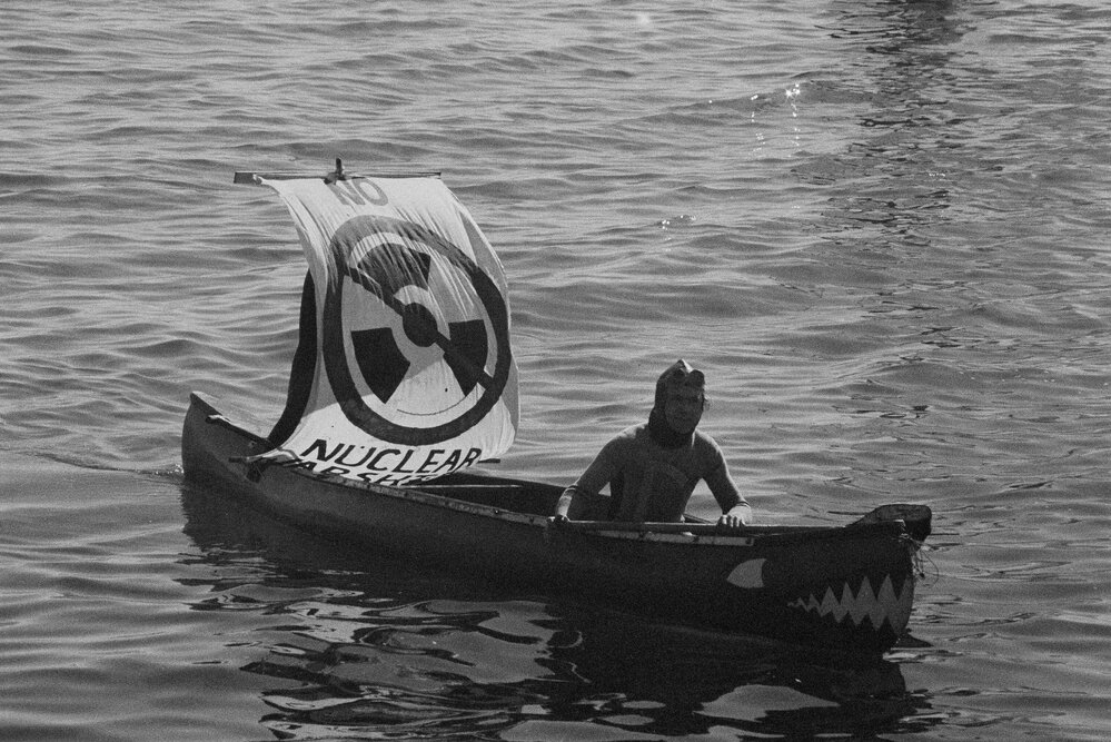 "Disarm now east and west" banner at Palm Sunday rally, April 1984.