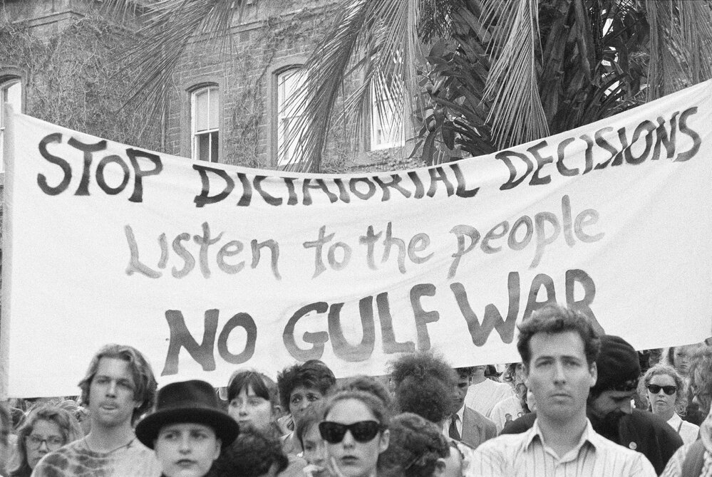 "Stop dictatorial decisions, listen to the people, no Gulf war" banner at Persian Gulf war protest march, 18 January 1991.