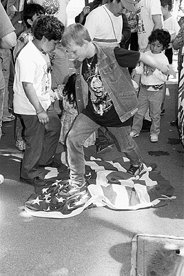 Stamping on American flag at El Salvador march to U.S. consulate offices, November 1990.