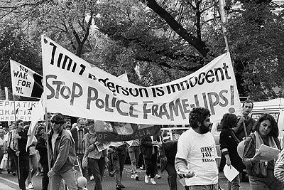 "Tim Anderson is innocent, stop police frame ups" banner at May Day rally, 1991.
