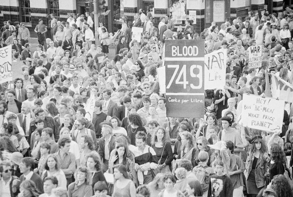 "Blood 74.9 cents a litre" posters at the second Persian Gulf war protest march, 25 January 1991.