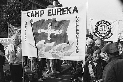 Mark Prosser and Gerry Harant holding Camp Eureka banner at May Day rally, 1991.