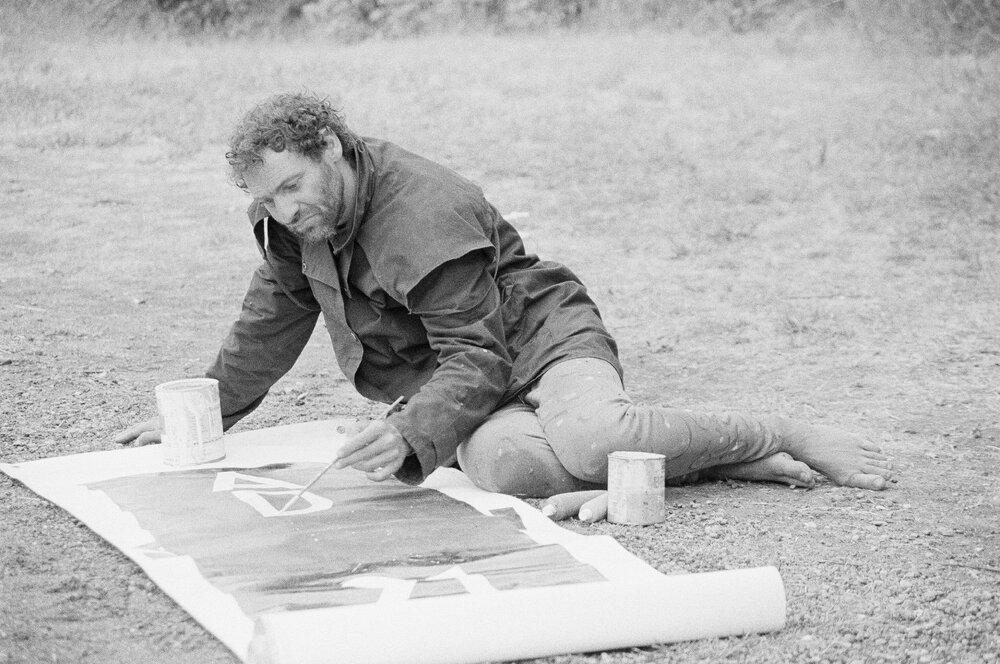 Benny Zable creating another banner at the Australian International Defence and Equipment Exhibition (AIDEX) protest, Canberra, 26 November 1991.