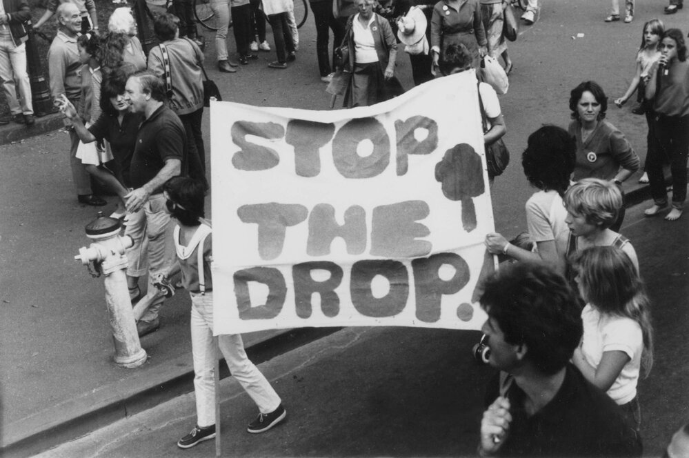 "Stop the drop" banner at Palm Sunday rally, April 1984..