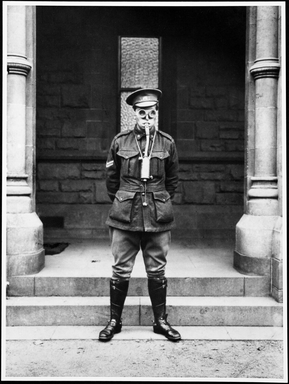 Corporal wearing gas respirator