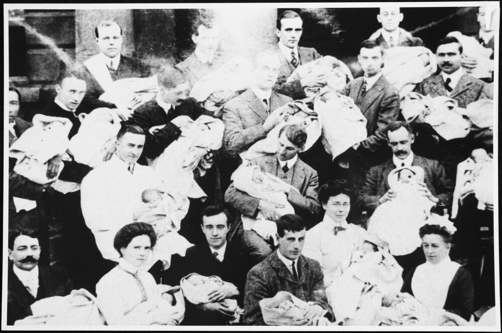 Medical students with babies. Early 1900s
