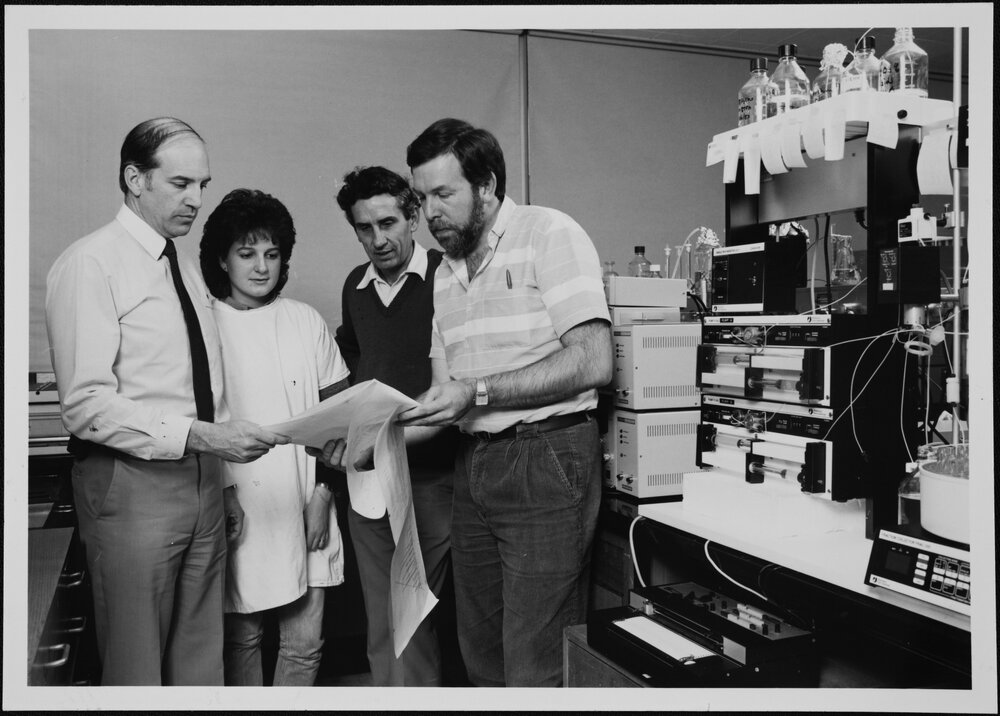 Cole, Dr Bill of Pediatrics, checks computer printouts of collagen research with Graduate Research Assistant Sue Golub and Dr David Peters of CSIRO and Dr John Bateman, University of Melbourne