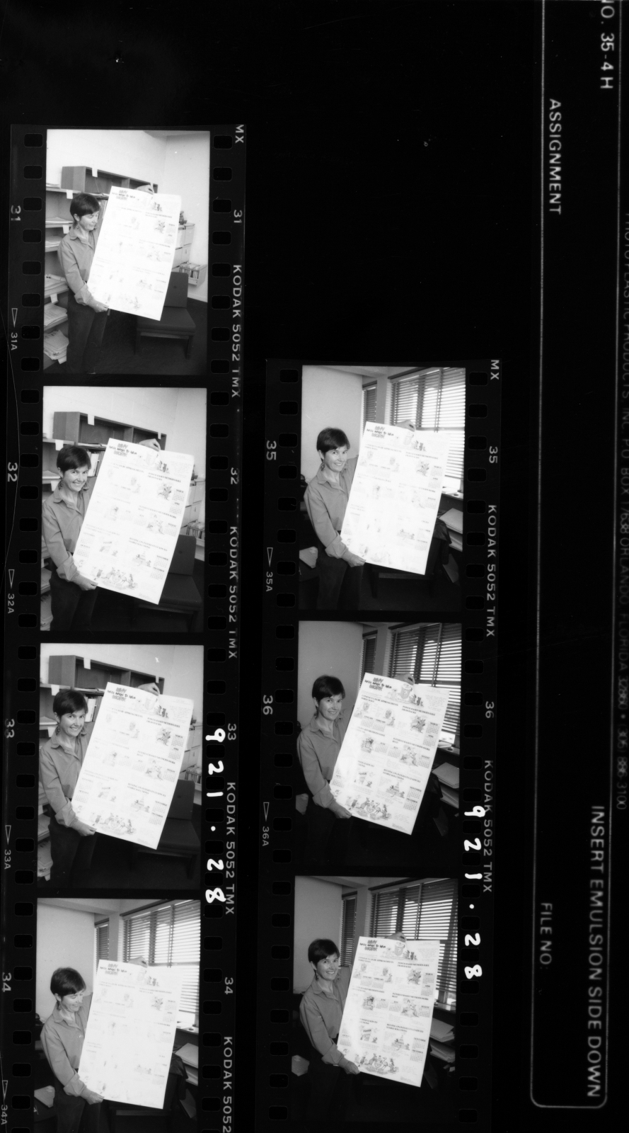 Sanson, Dr Ann, Psychology, holding a 1992 calendar from Psychologists for the Prevention of War (PPOW)