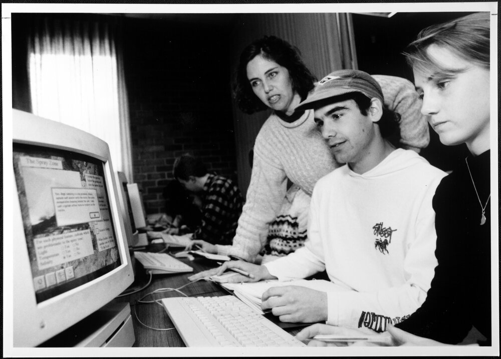 Biology. Roslyn Gleadow works with two students on one of the programs