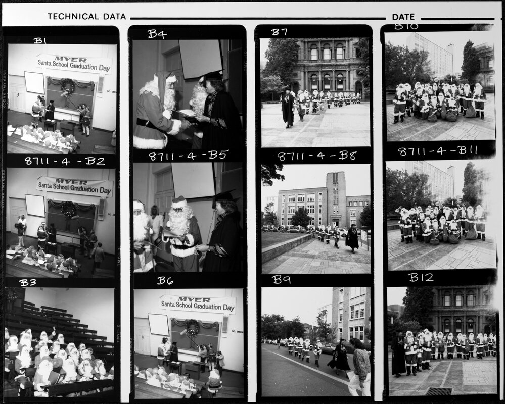 Santa School. Peggy McMurray (Personnel Services) presents graduation certificates to Santas at 1987 Santa School