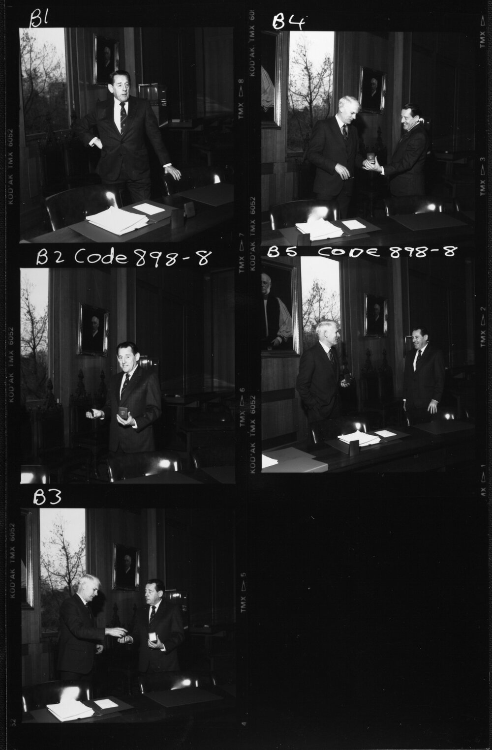 Pawsey, Maurice showing medal to J B. Potter