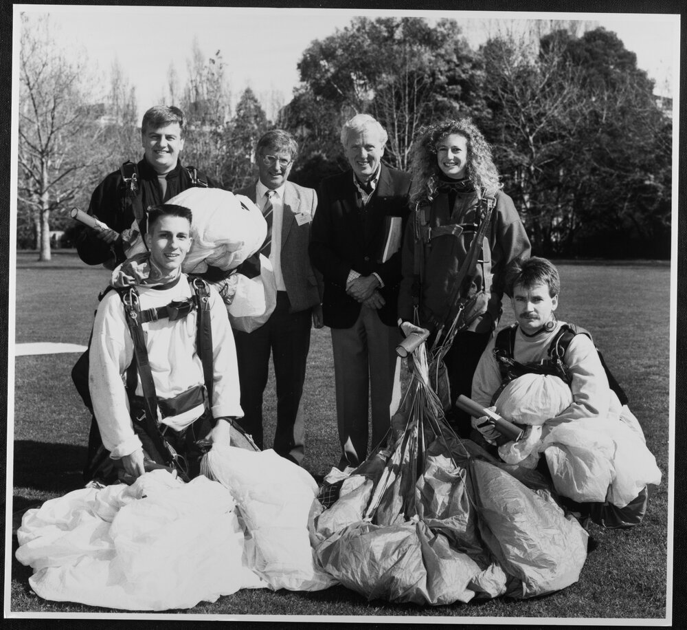 Discovery Day - Vice-Chancellor David Penington with skydivers. 1991