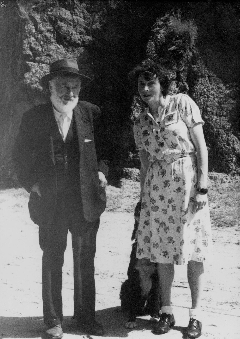 Sydney Jephcott and Elyne Mitchell standing together in a garden.