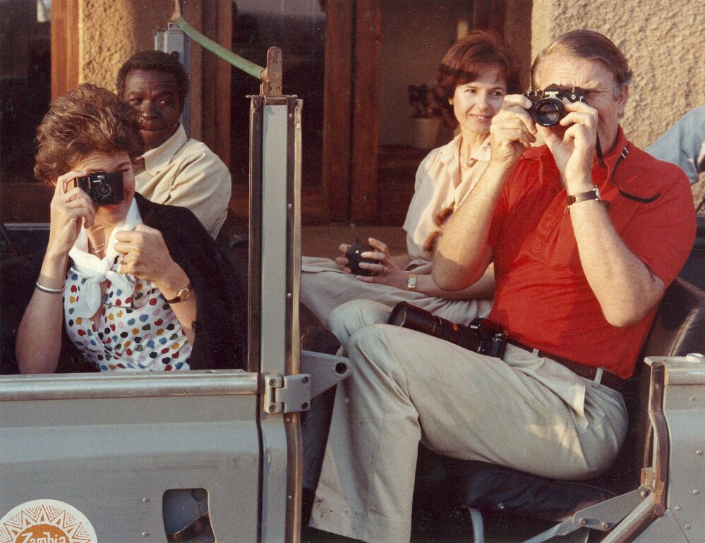 Tamie Fraser and Malcolm Fraser taking photographs during a visit to Zambia.