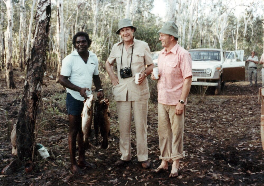 Malcolm Fraser relaxing with Galarrwuy Yunupingu, Chair of the Northern Land Council, and others after a fishing trip in the Northern Territory.
