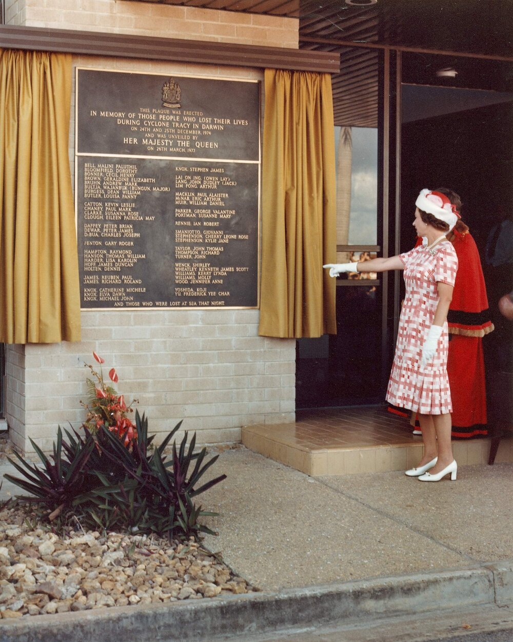 Queen Elizabeth II at the unveiling of a memorial in Darwin to the victims of Cyclone Tracy, during her 1977 official visit to Australia.