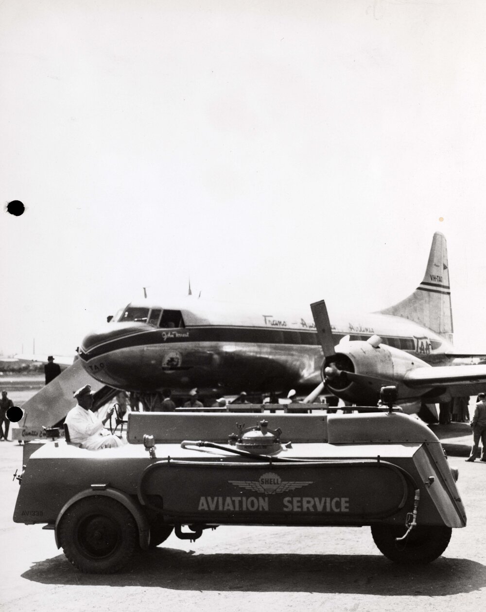 Shell Aviation Service equipment in front of Trans Australia Airlines U.S. made Convair CV-240-5 aircraft