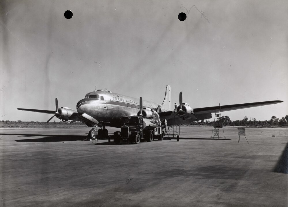 Douglas DC-4 Skymaster being refuelled from a Shell Aviation Service British Albion tanker truck