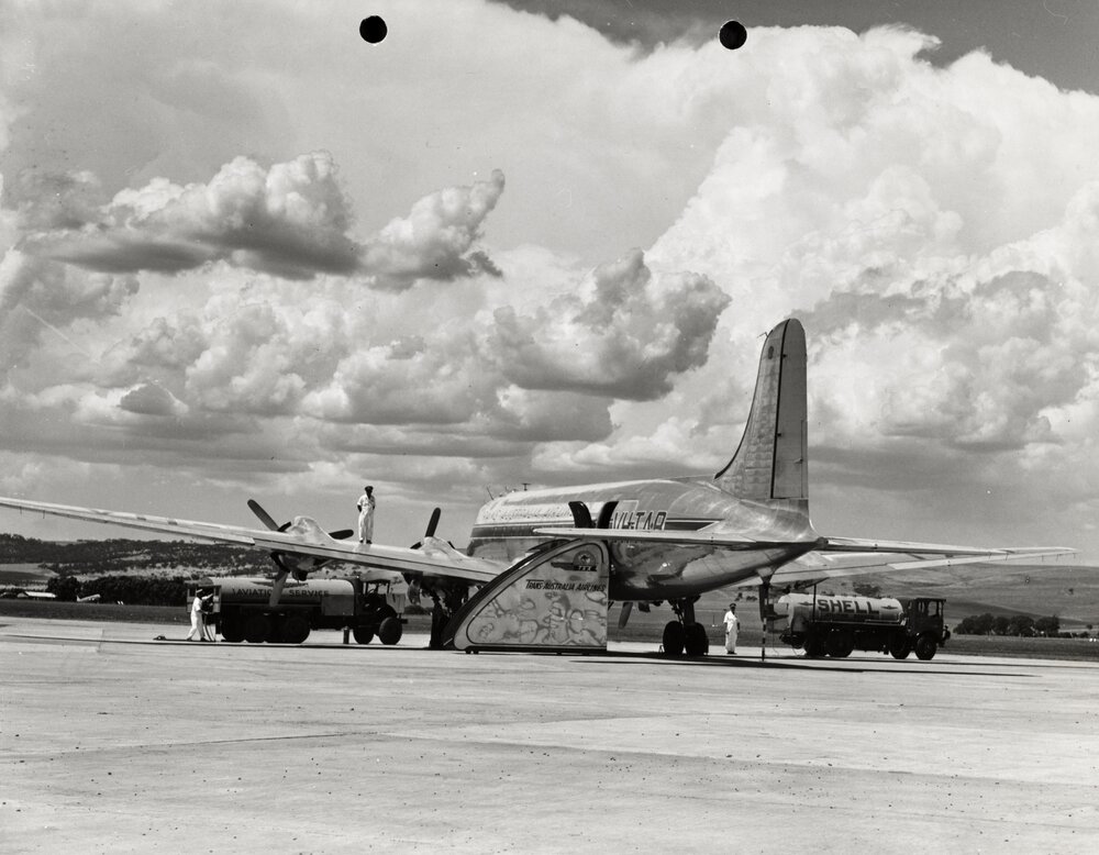 A Douglas DC-4 Skymaster aircraft, undergoing refuelling at Parafield Airport, Adelaide, South Australia.