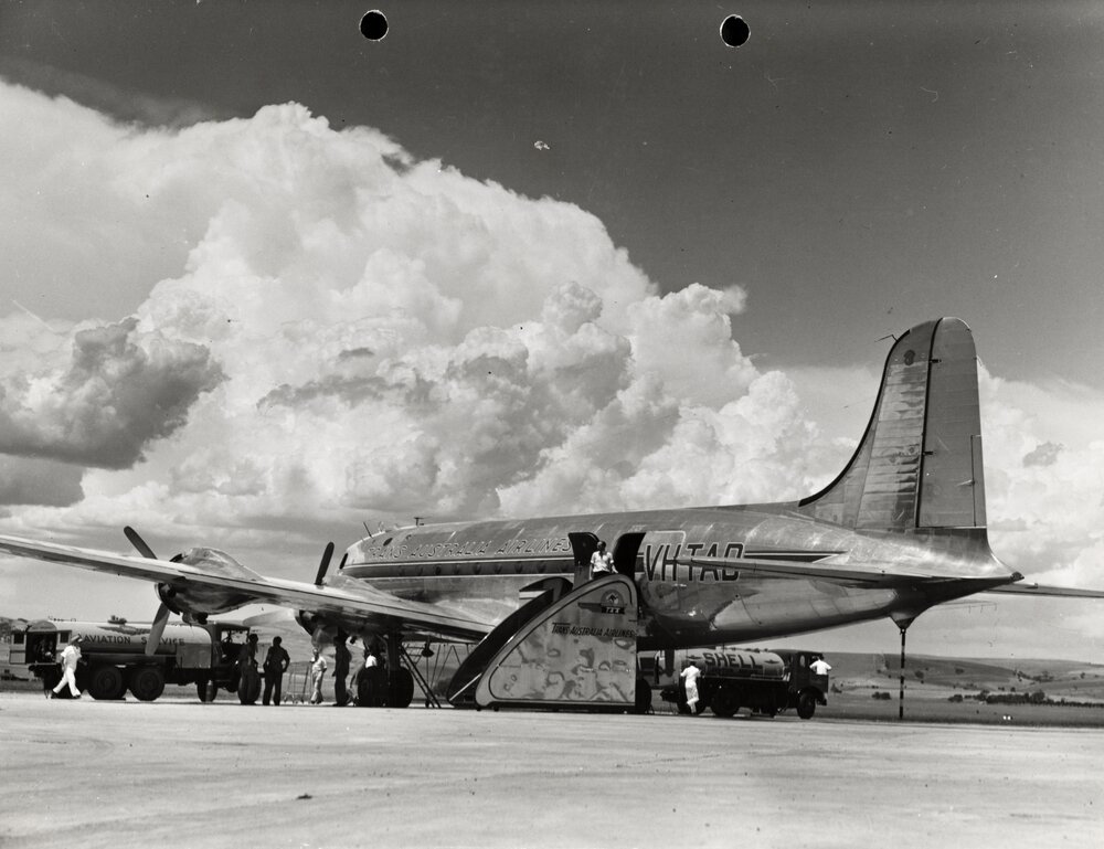 Douglas DC-4 Skymaster aircraft, undergoing refuelling at Parafield Airport, Adelaide, South Australia