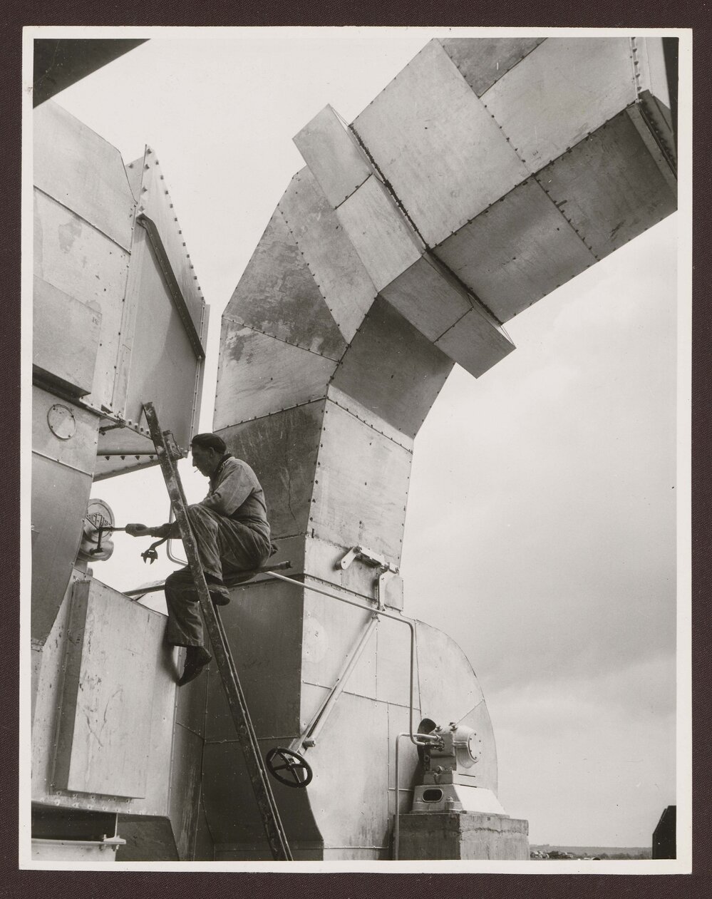 Men working on outdoor machinery