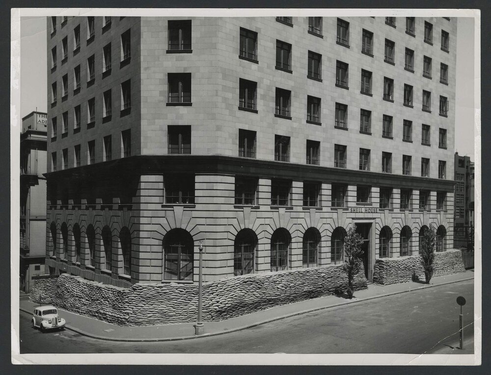 Shell House, Sydney with sandbags stacked around base