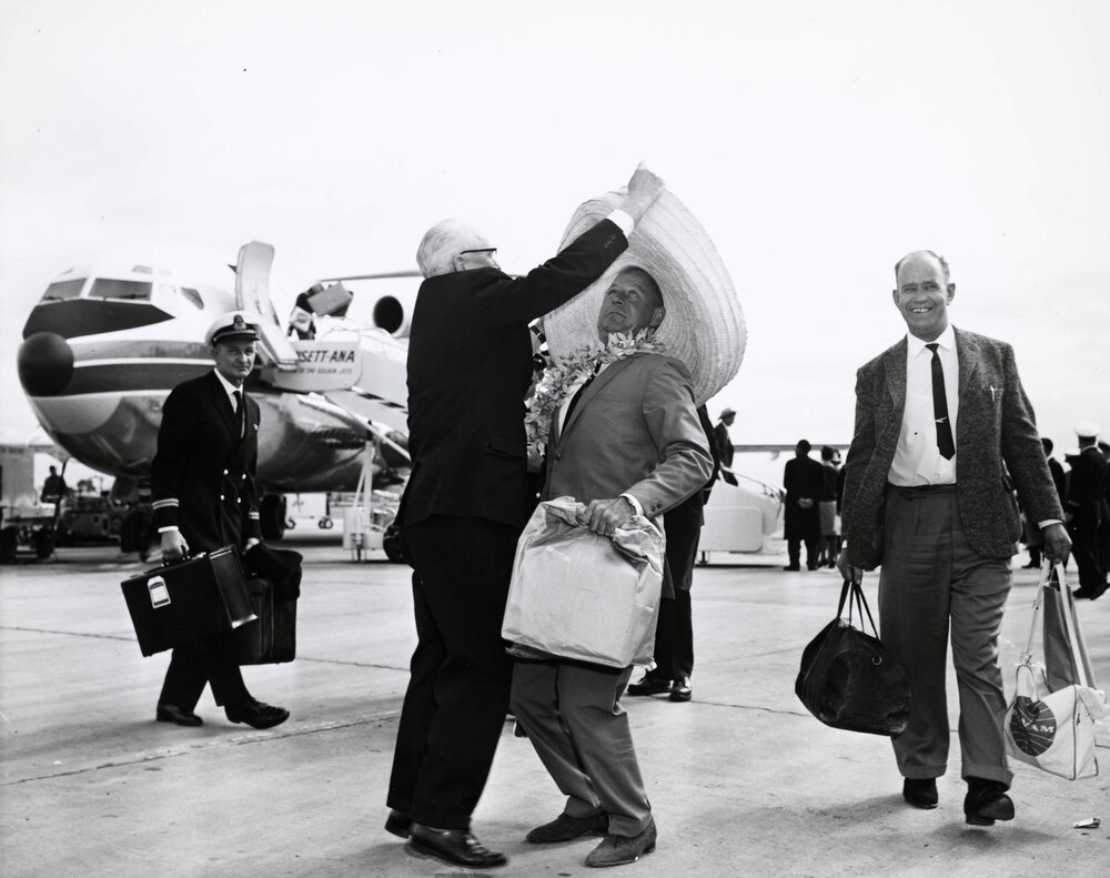 Unidentified men on the apron of an airport, probably at Essendon Airport, Melbourne, in front of an Ansett-ANA, US built Boeing 727 aircraft