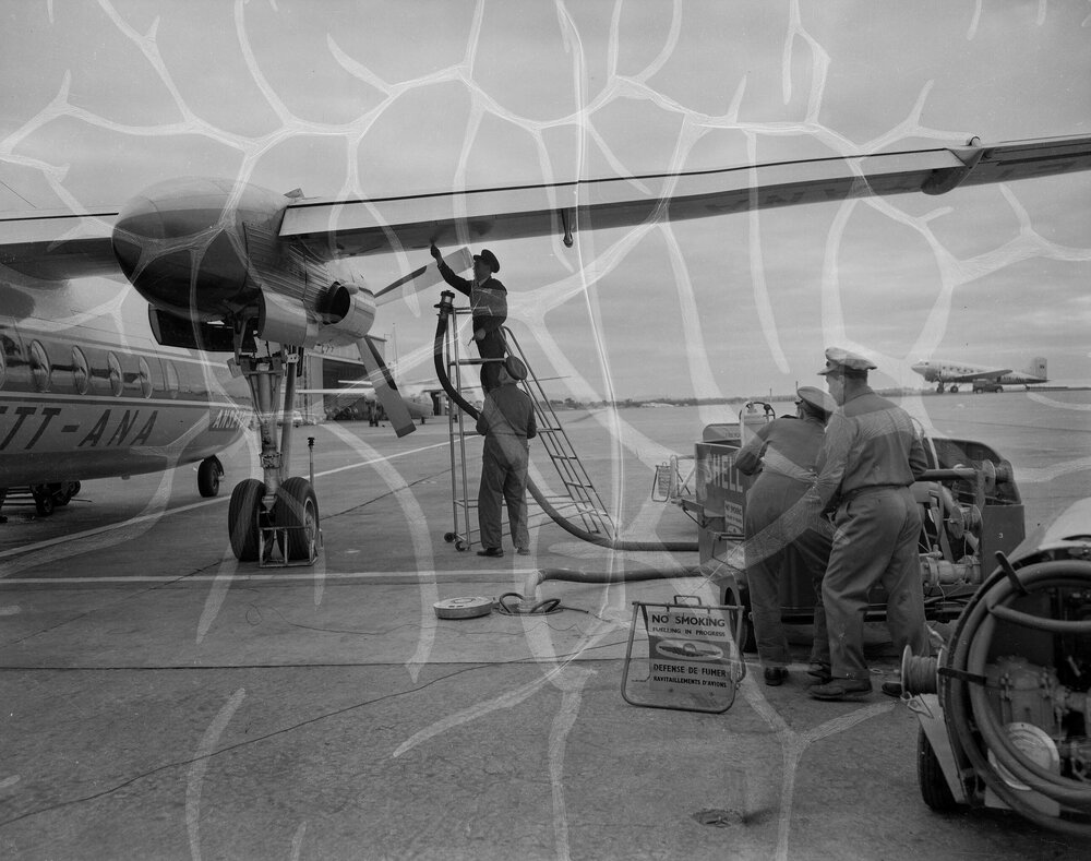 An Ansett-ANA Fokker F27 Friendship being refuelled by Shell Australia workers on the apron of an unidentified Australian airport