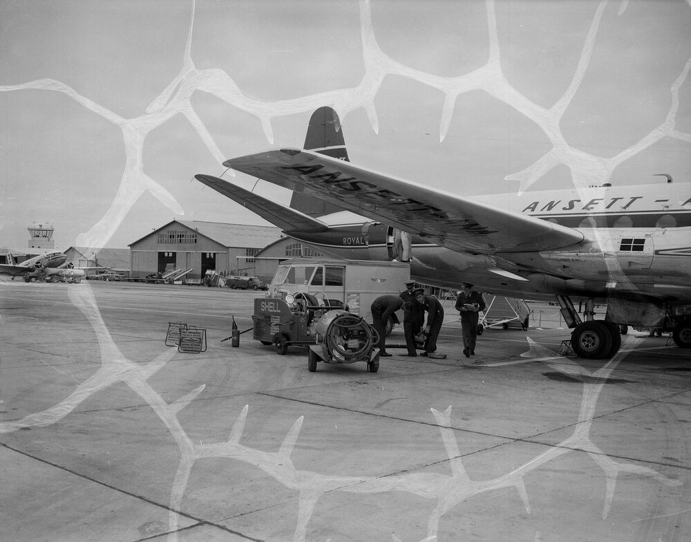 An Ansett-ANA British built Vickers Viscount 11 carrying Australian registration VH-RMI, being refuelled by Shell Australia workers, in front of terminal buildings at an unidentified Australian airport.