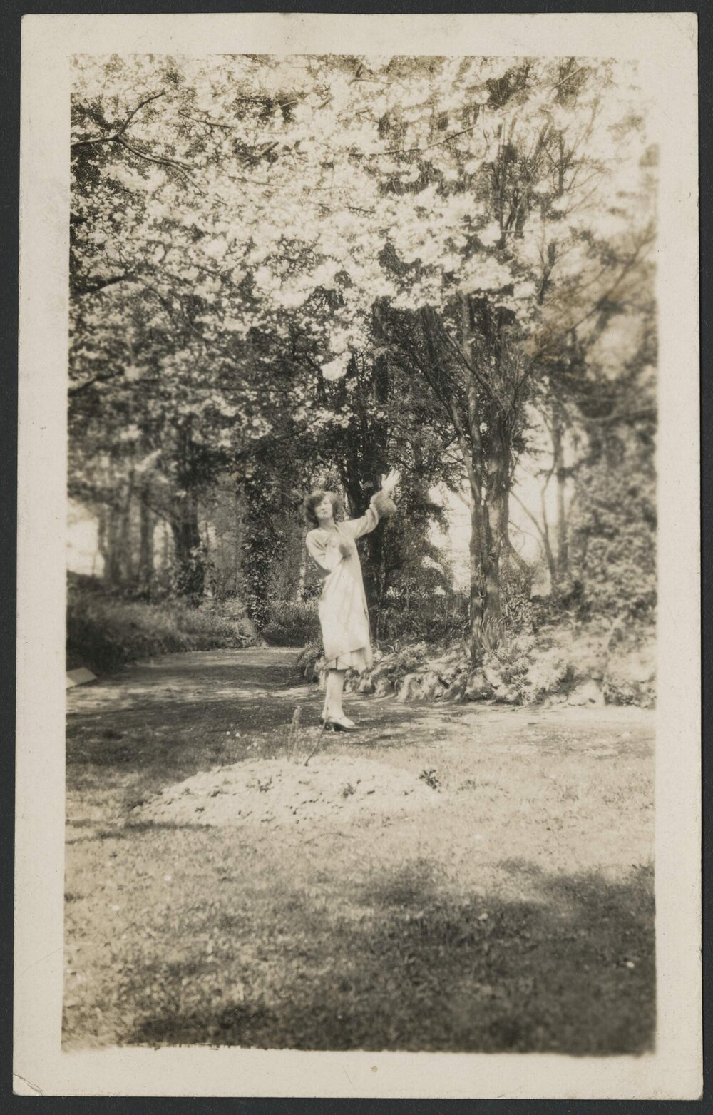 Christian Waller in garden under trees