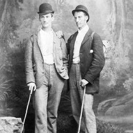 Full-length photo of two young men, standing